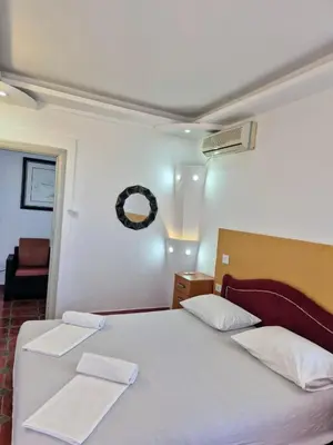 a bedroom with a large bed with two white pillows at Apartments Yll in Ulcinj