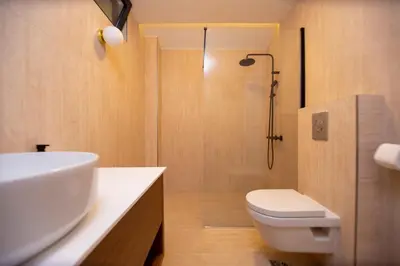 a bathroom with a sink and a toilet and a shower at Casa del Sol Zagora in Zagora