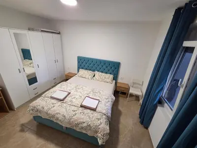 a bedroom with a bed with two books on it at Guest house Danica in Bar