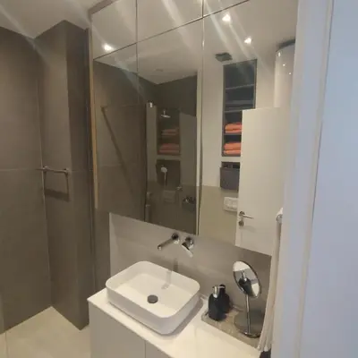a bathroom with a sink and a shower at Apartman Gioia in Becici