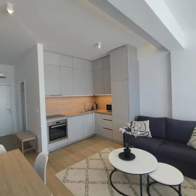 a living room with a couch and a table at Apartman Gioia in Becici