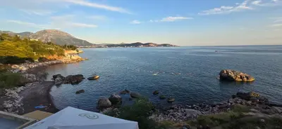 a view of a large body of water with rocks at Beachfront Blue Panorama in Bar