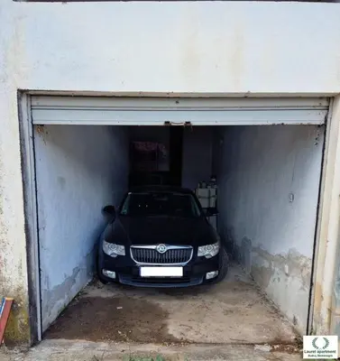 a car is parked inside of a garage at Laurel Apartment See View in Budva