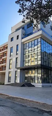 a building with a lot of windows on it at Apartments Arb in Ulcinj