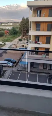 a balcony of a building with a parking lot at Apartments Arb in Ulcinj