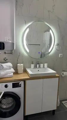 a bathroom with a sink and a mirror at Soho holiday in Bar