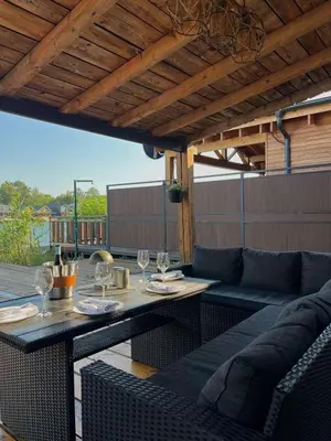 a patio with a table and chairs and a couch at Casa Tiramisù in Ulcinj