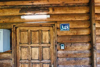 a wooden door with a sign on it at Casa Tiramisù in Ulcinj