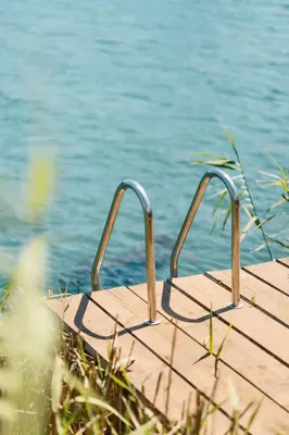 a wooden boardwalk next to a body of water at Casa Tiramisù in Ulcinj