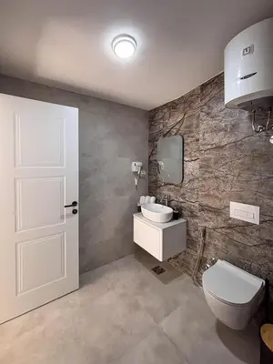 a bathroom with a toilet and a sink at Harasani apartments in Ulcinj