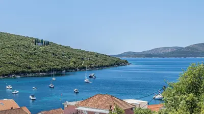 a view of a large body of water with boats at Skyline Residences in Bigovo