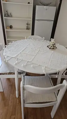a white table with two chairs and a white table and chairs at Lena's Place Near City Center in Bar