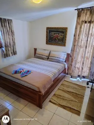 a bedroom with a bed in a room at Apartman V,P in Sutomore