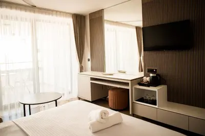 a hotel room with a bed with a towel at Cervino in Ulcinj
