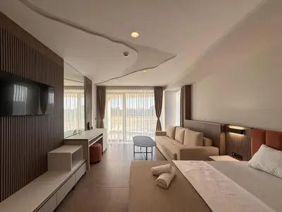 a hotel room with a bed and a couch at Cervino in Ulcinj