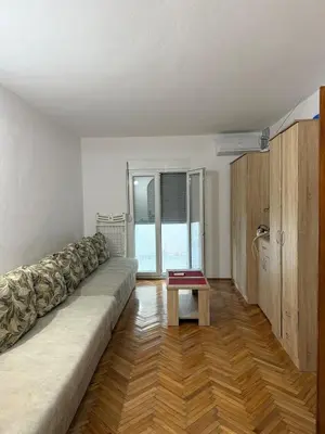 a living room with a couch and a table at Ivan's Apartment in Budva in Budva