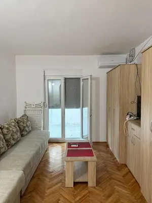 a living room with a couch and a coffee table at Ivan's Apartment in Budva in Budva