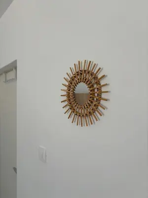 a mirror hanging on a wall in a room at Deaf Valley Apartment 1 in Reljići