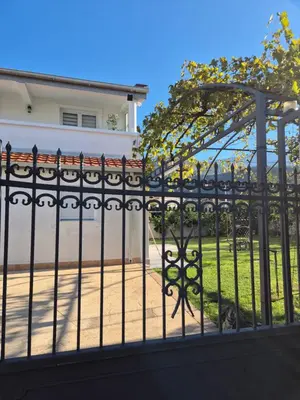 a black iron fence in front of a house at Hayal Apartment in Bar