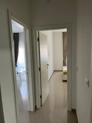 a hallway with two open doors and a bedroom at Amber Sky Apartments in Bjeliši