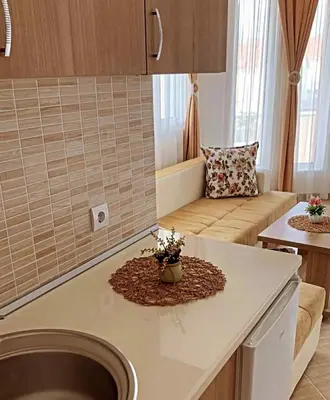 a kitchen with a sink and a couch in a room at Villa Doda - Donji Stoj - Ulcinj in Ulcinj