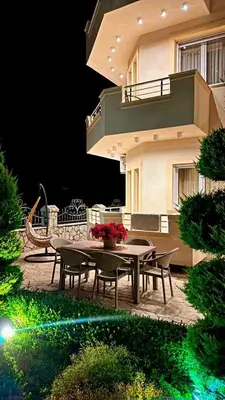 a patio with a table and chairs in front of a building at Villa Doda - Donji Stoj - Ulcinj in Ulcinj
