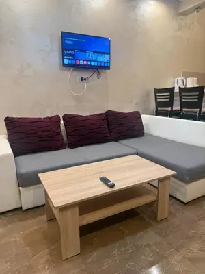 a living room with a couch and a coffee table at Apartman Martina 3 in Rafailovici