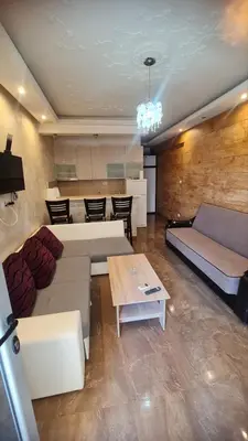 a living room with two couches and a table at Apartman Martina 3 in Rafailovici