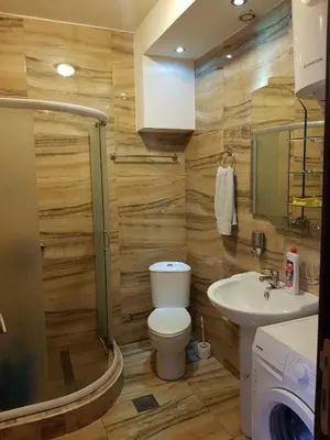 a bathroom with a toilet and a sink at Apartman Martina 3 in Rafailovici