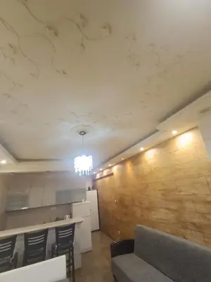 a living room with a couch and a wall at Apartman Martina 3 in Rafailovici