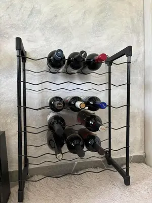 a wine rack filled with lots of wine bottles at Deaf Valley Apartment 2 in Reljići