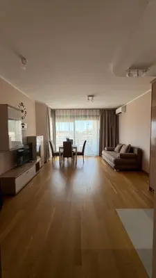 a living room with a couch and a table at One bedroom apartment with sea view Becici in Becici