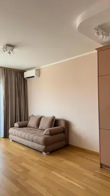 a living room with a couch in a room at One bedroom apartment with sea view Becici in Becici