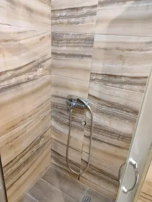 a bathroom with a shower with a glass door at Martina 1 in Budva