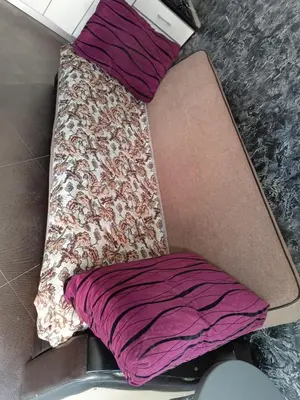 a bed in a room with a pillow and blanket at Martina 1 in Budva