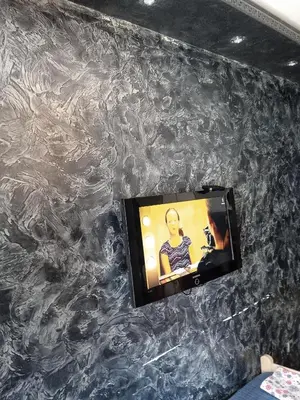 a tv on a wall covered in plastic at Martina 1 in Budva