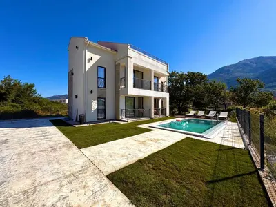 an exterior view of a house with a swimming pool at Villa Anastasija in Kotor