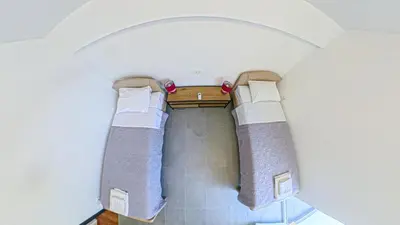 an overhead view of two beds in a room at Barona Seaview Penthouse Kotor Bay in Kotor