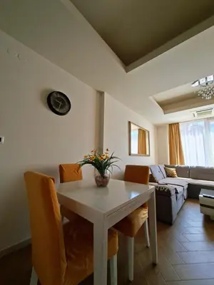 a living room with a white table and chairs at Cozy City Center Studio in Babalonija