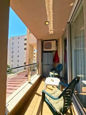 a balcony with two chairs and a table at Cozy City Center Studio in Babalonija