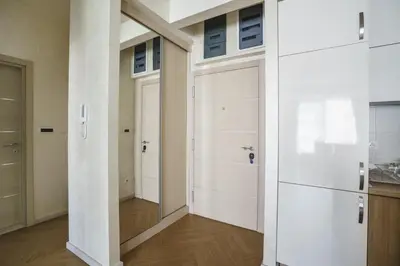 a hallway with two garage doors in a room at Cozy City Center Studio in Babalonija