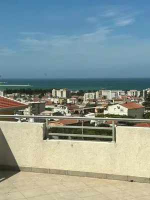 a view of a city from a building at Villa Alidah Avkoppling med utsikt, pool och fruktträd in Bar