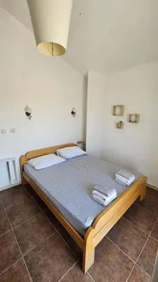 a bedroom with a bed with two towels on it at Villa With Swimming Pool in Ulcinj