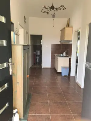 a kitchen with a tiled floor and a large room at Villa With Swimming Pool in Ulcinj