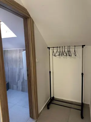 a room with a closet with hangers on the wall at Apartments ML in Kotor