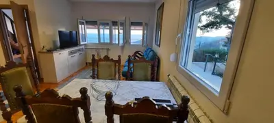 a dining room with a table and a window at House with pool and seaview in Kuljače