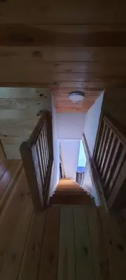 an overhead view of a wooden staircase in a cabin at House with pool and seaview in Kuljače