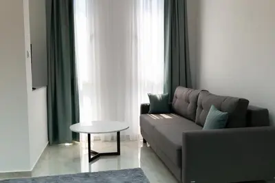 a living room with a couch and a table at Diamonds Xh&A Apartments in Ulcinj