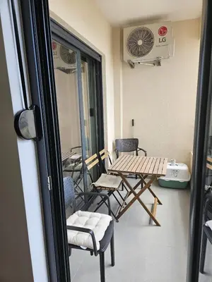 a balcony with a table and chairs in a room at Apartament Onyx in Becici