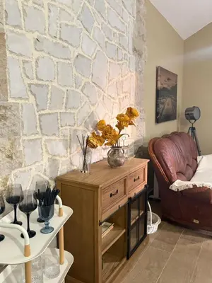 a living room with a couch and a table at Golden Ray Bigova in Bigovo